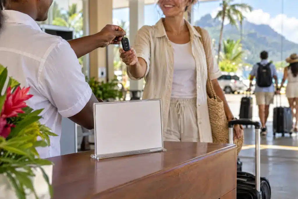 Tourist collecting rental car keys at Mahé airport
